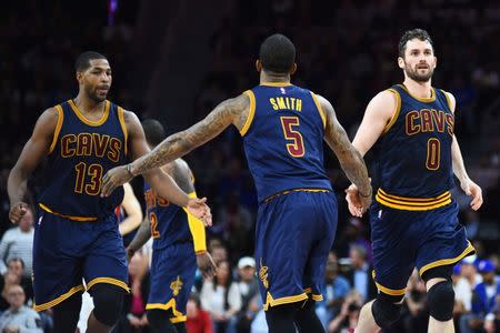 Apr 22, 2016; Auburn Hills, MI, USA; Cleveland Cavaliers guard J.R. Smith (5) high fives forward Kevin Love (0) and center Tristan Thompson (13) during the fourth quarter against the Detroit Pistons in game three of the first round of the NBA Playoffs at The Palace of Auburn Hills. Mandatory Credit: Tim Fuller-USA TODAY Sports