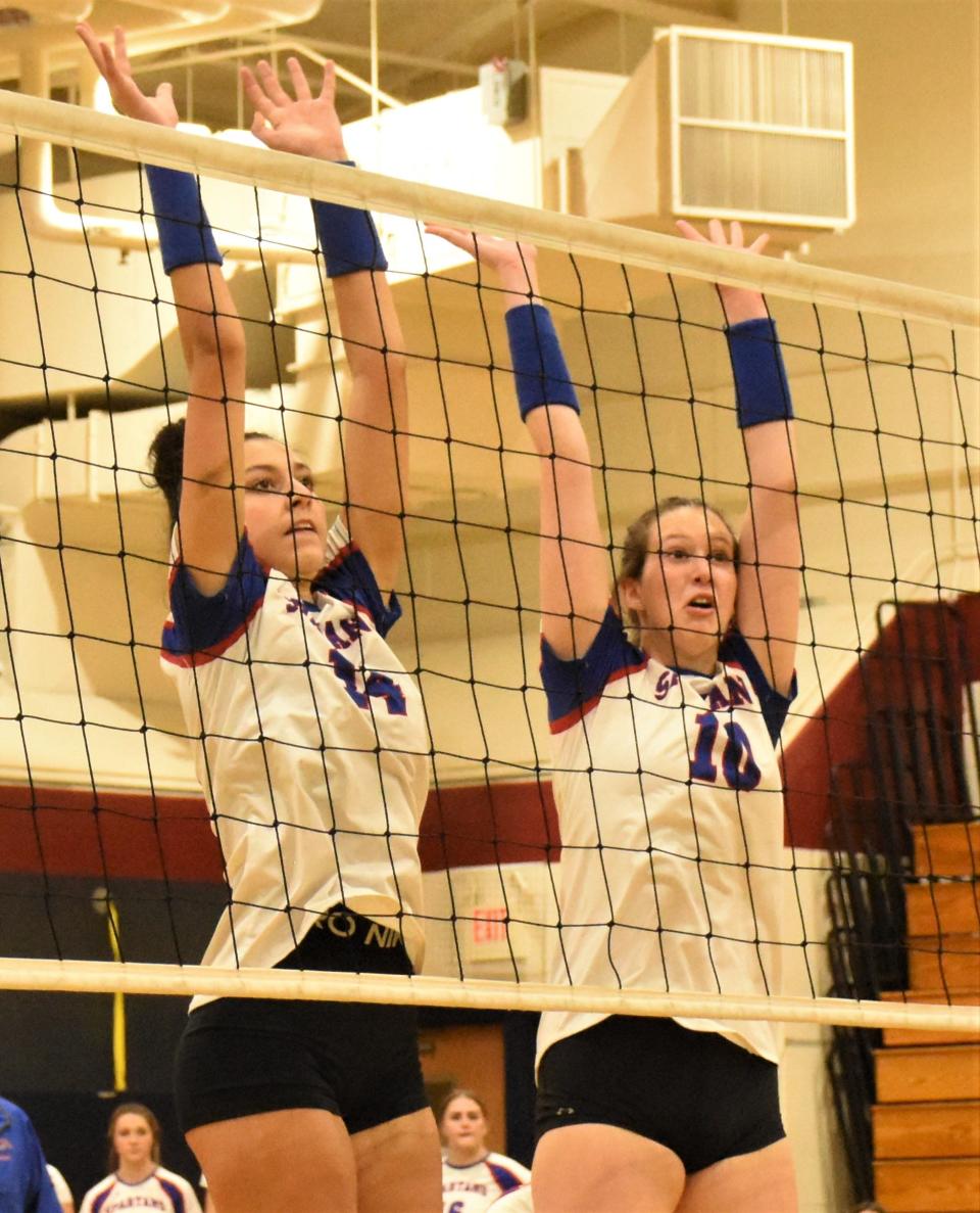 New Hartford Spartans Keegan Matthews and Madison Freiberger (from left) set up a block against Rome Free Academy during a Nov. 27, 2023, match in New Hartford.
