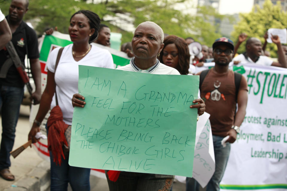 Women attend a demonstration calling on government to rescue kidnapped school girls of a government secondary school Chibok, during workers day celebration in Lagos, Nigeria. Thursday, May, 1. 2014, Scores of girls and young women kidnapped from a school in Nigeria are being forced to marry their Islamic extremist abductors, a civic organization reported Wednesday. At the same time, the Boko Haram terrorist network is negotiating over the students' fate and is demanding an unspecified ransom for their release, a Borno state community leader told The Associated Press. He said the Wednesday night message from the abductors also claimed that two of the girls have died from snake bites. The message was sent to a member of a presidential committee mandated last year to mediate a ceasefire with the Islamic extremists, said the civic leader, who spoke on condition of anonymity because he is not authorized to speak about the talks. (AP Photo/ Sunday Alamba)