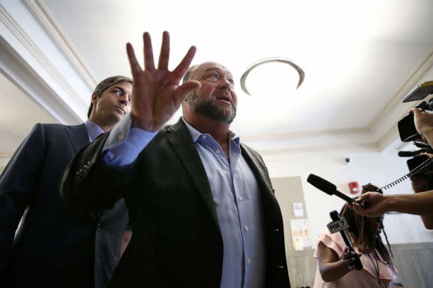 PHOTO: Alex Jones talks to media during a midday break at the Travis County Courthouse in Austin, Texas, July 26, 2022. (Briana Sanchez/Reuters. FILE)