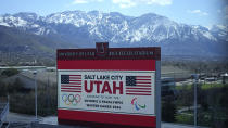 The scoreboard at the University of Utah's Rice-Eccles Stadium promotes Salt Lake City's bid to host another Winter Olympics in 2034 as International Olympic Committee members prepare to tour the stadium and other venues Wednesday, April 10, 2024, in Salt Lake City. (AP Photo/Rick Bowmer)