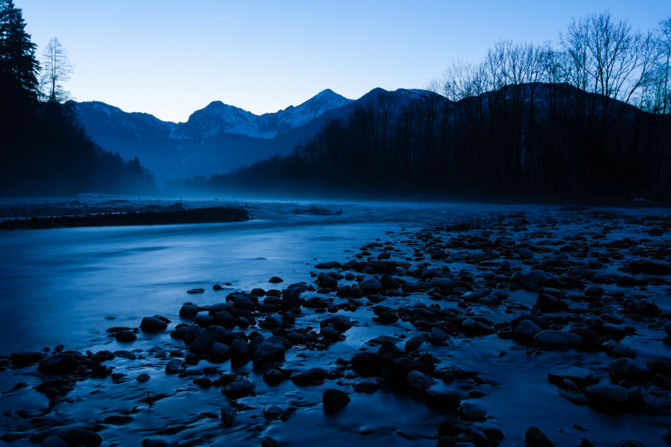 January 15: Blue by ge-org. 'In anticipation of the Blue Hour (the hour of twilight where there is neither daylight nor darkness) I rode my bike to the river Tiroler Ache in Upper Bavaria, Germany. It was getting dark and the way was quite bumpy and partially covered in a thick layer of ice so I had to get off the bike and walk the last hundred meters. I made my way across the river bed until I reached the edge of the water. Just then the sun disappeared behind the mountains and the whole scene was immersed in beautiful blue light. I set up my camera and started taking pictures while enjoying the great scenery.'