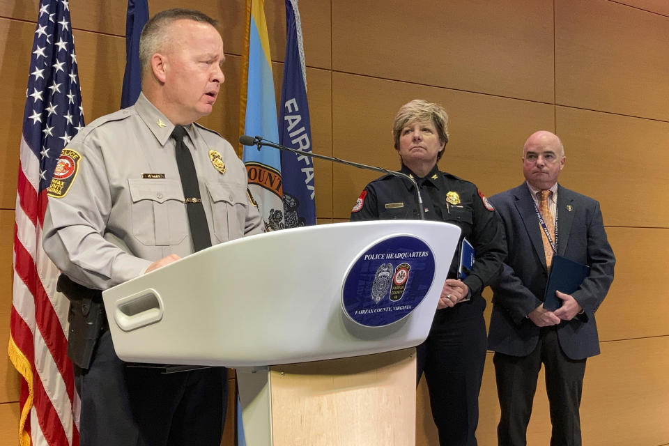 Fairfax County Police Chief Kevin Davis, left, joined by Harrisonburg Police Chief Kelley Warner, center, and Fairfax County Police Maj. Ed O'Carroll, speak about murder charges against Anthony Robinson, 35, of Washington, D.C., during a press conference, Friday, Dec. 17, 2021, in Fairfax, Va. Police dubbed their suspect the "shopping cart killer" because he used a grocery shopping cart to move his victims' bodies after killing them. (AP Photo/Matthew Barakat)