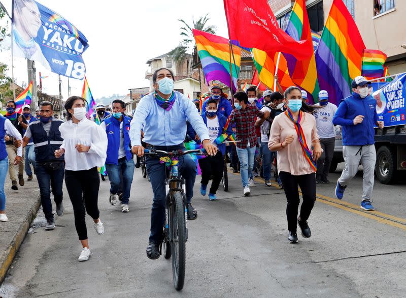 FILE PHOTO: Ecuadorean presidential candidate Yaku Perez rides his bike during his closing campaign rally ahead of the February 7 presidential vote, in Cuenca