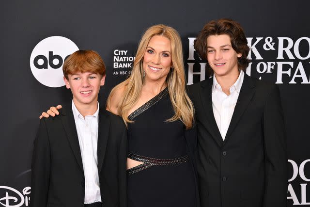 <p>ANGELA WEISS/AFP via Getty </p> Sheryl Crow and sons Levi (left) and Wyatt (right) attend the 38th Annual Rock & Roll Hall of Fame Induction Ceremony.