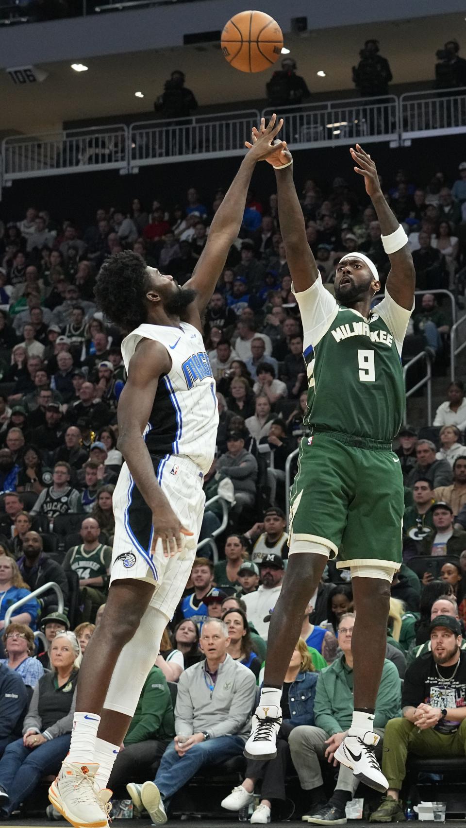 Bucks forward Bobby Portis shoots over Magic forward Jonathan Isaac on April 10 at Fiserv Forum.