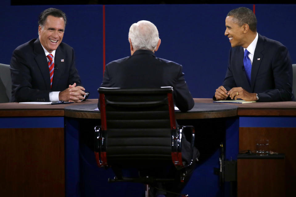 Republican presidential nominee Mitt Romney and President Barack Obama react to moderator Bob Schieffer during the third presidential debate at Lynn University, Monday, Oct. 22, 2012, in Boca Raton, Fla. (AP Photo/Charlie Neibergall)