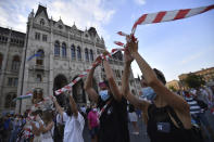 Students of the University of Theatre and Film Arts (SZFE) and their sympathizers form a human chain in protest against changes to the way the university is governed in Budapest, Hungary, Sunday, Sept. 6, 2020. (Marton Monus/MTI via AP)