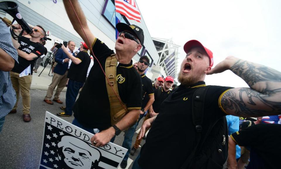 Members of the Proud Boys face off against anti-Trump protesters.