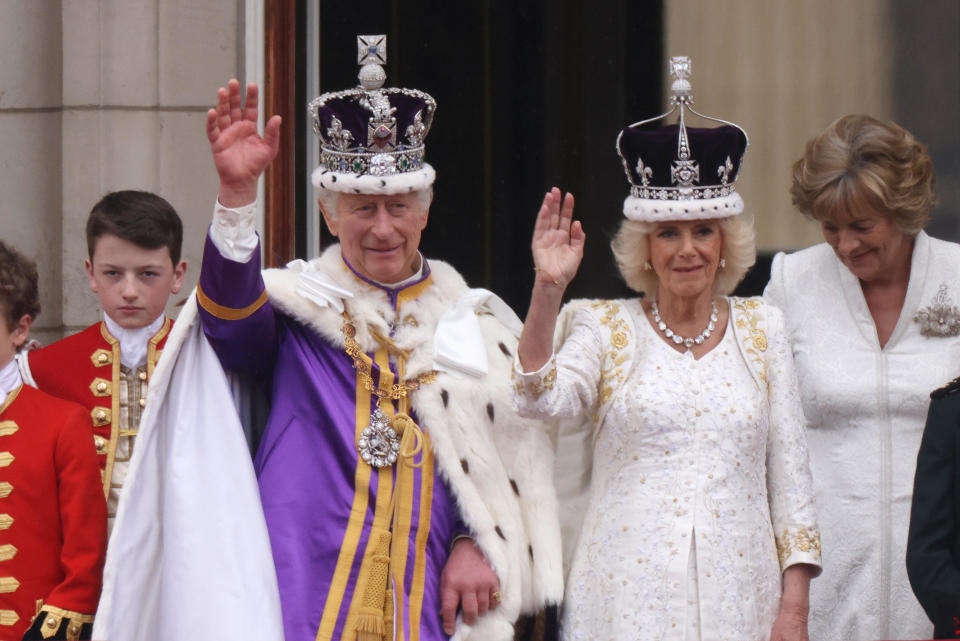 King Charles III and Queen Camilla can be seen on the Buckingham Palace balcony ahead of the fly-past during the coronation day events, May 6, 2023 in London, England. / Credit: Getty Images