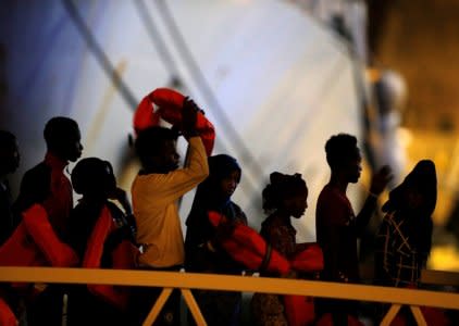 Migrants disembark from an Armed Forces of Malta (AFM) patrol boat after 120 rescued migrants were brought to the AFM Maritime Squadron base at Haywharf in Valletta's Marsamxett Harbour, Malta October 7, 2018. REUTERS/Darrin Zammit Lupi