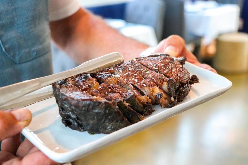 Chef/butcher James Muir owns a cozy steakhouse that pops with a world of flavors. Nicholson Muir Distinguished Meats offers premium steaks, seafood and inspired bites in a historic cottage in Boynton Beach.