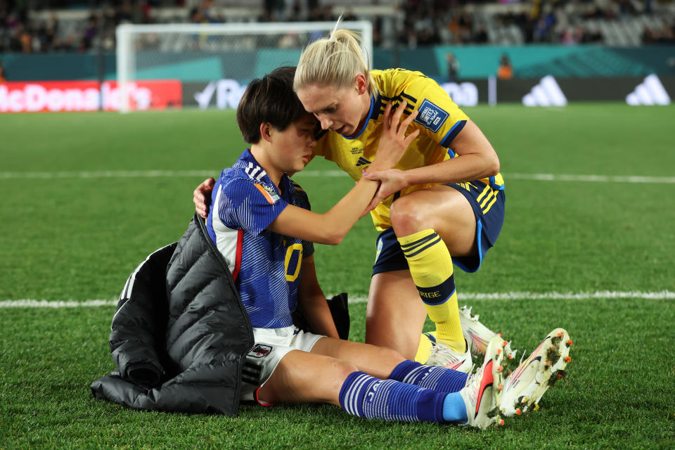 AUCKLAND, NEW ZEALAND - AUGUST 11: Maika Hamano of Japan is consoled by Jonna Andersson of Sweden after the FIFA Women's World Cup Australia & New Zealand 2023 Quarter Final match between Japan and Sweden at Eden Park on August 11, 2023 in Auckland / Tāmaki Makaurau , New Zealand. (Photo by Alex Grimm - FIFA/FIFA via Getty Images)