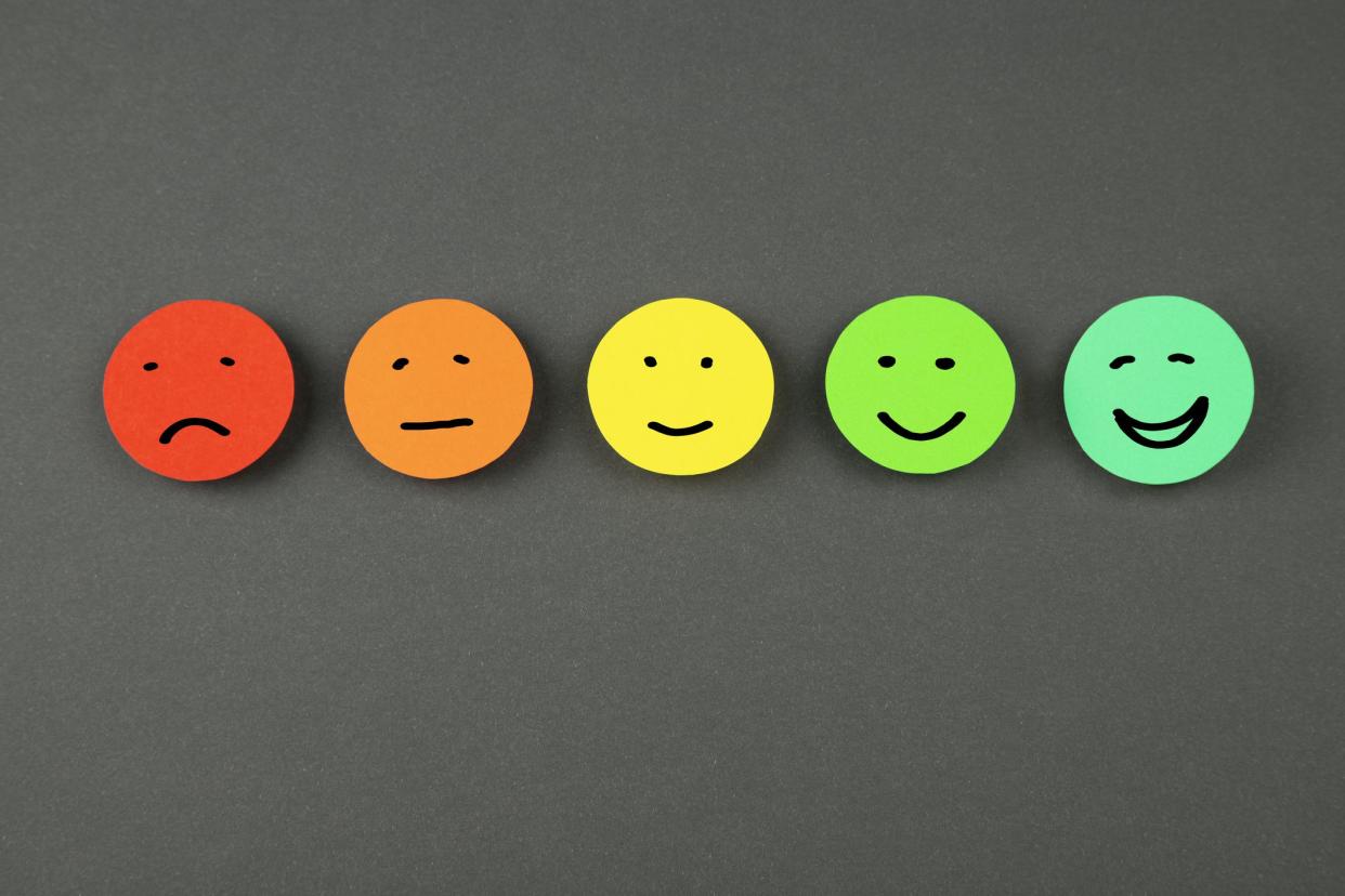 Colorful smileys on chalkboard background