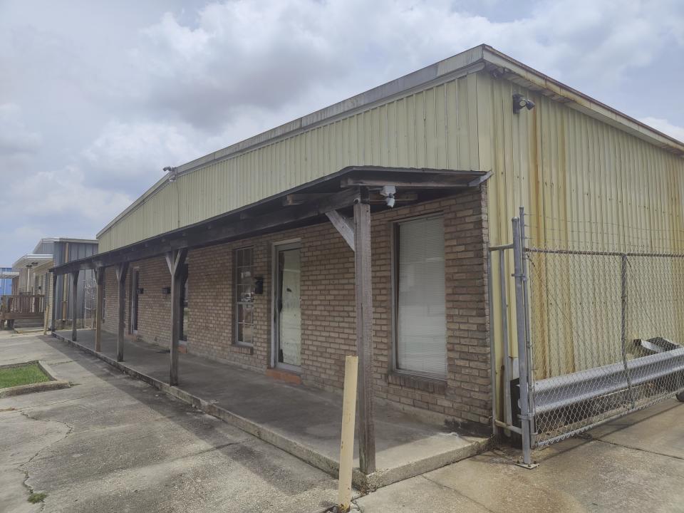 The front awning hangs from the dilapidated unapproved school named Second Chance Academy, in Baton Rouge, La., June 19, 2023. The school has come under scrutiny since its head teacher was arrested on charges of sexually abusing students. (Charles Lussier/The Advocate via AP)