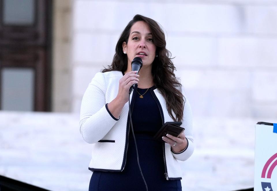 Sen. Jessica de la Cruz, the House minority leader, speaks in support of Israel during Tuesday evening's rally at the State House.