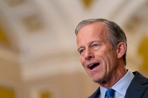 Sen. John Thune (R-S.D.) speaks to reporters after a Senate Republican policy lunch in October 2023.