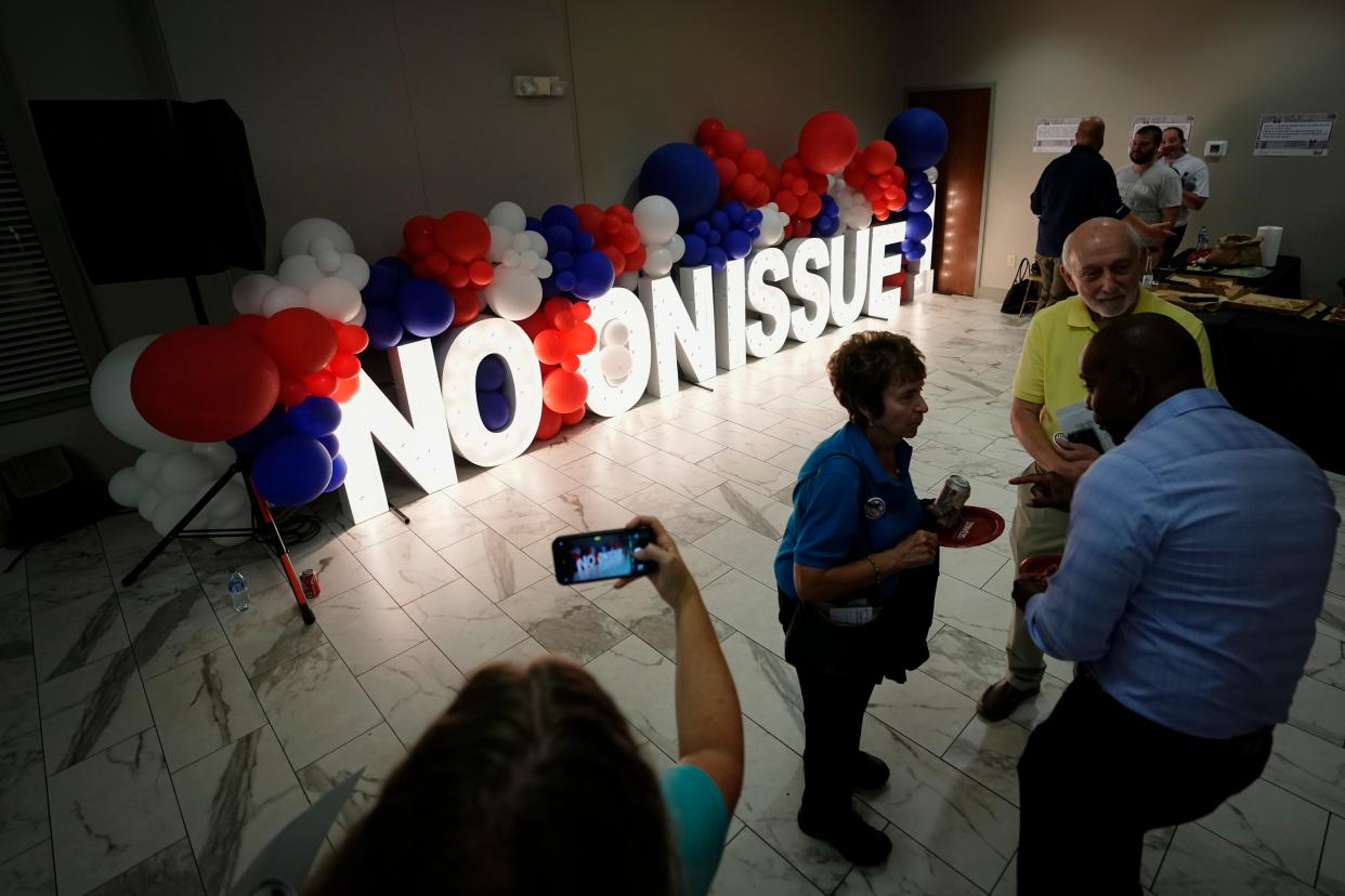 Aug 8, 2023; Columbus, Ohio, USA;  People celebrate the defeat of Issue 1 during an election night party at the Columbus Fire Fighters Local 67. 