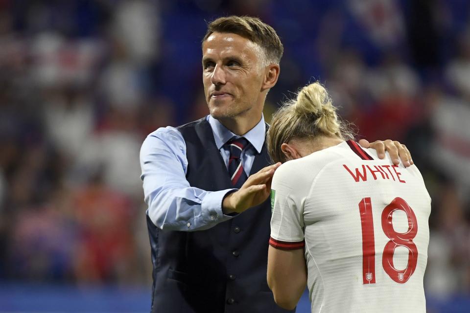 England's coach Phil Neville (C) comforts England's forward Ellen White at the end of the France 2019 Women's World Cup semi-final football match between England and USA, on July 2, 2019, at the Lyon Satdium in Decines-Charpieu, central-eastern France. (Photo by Philippe DESMAZES / AFP)        (Photo credit should read PHILIPPE DESMAZES/AFP/Getty Images)