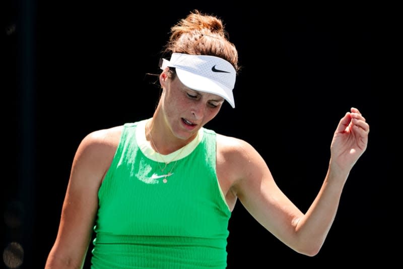 German tennis player Tatjana Maria reacts after losing a point to Colombia's Camila Osorio during their Women's Singles first round tennis match on Day 2 of the 2024 Australian Open at Melbourne Park. Frank Molter/dpa