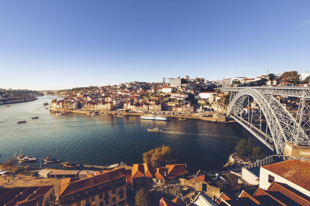 The city is built into steep hillsides while still hugging the riverfront (iStock)