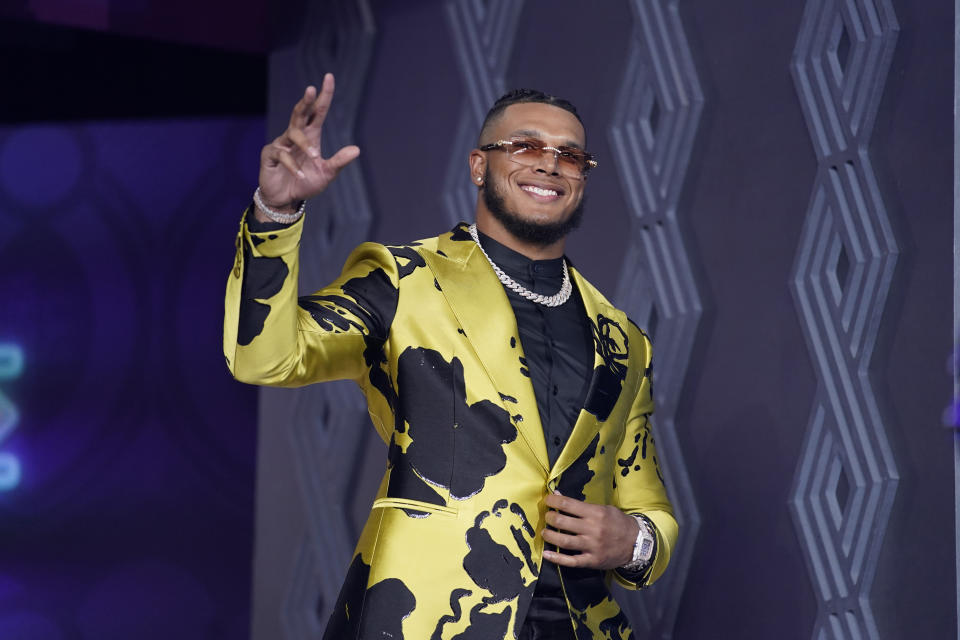 Florida State defensive end Jermaine Johnson II waves as he is introduced during the first round of the NFL football draft Thursday, April 28, 2022, in Las Vegas. (AP Photo/Jae C. Hong)
