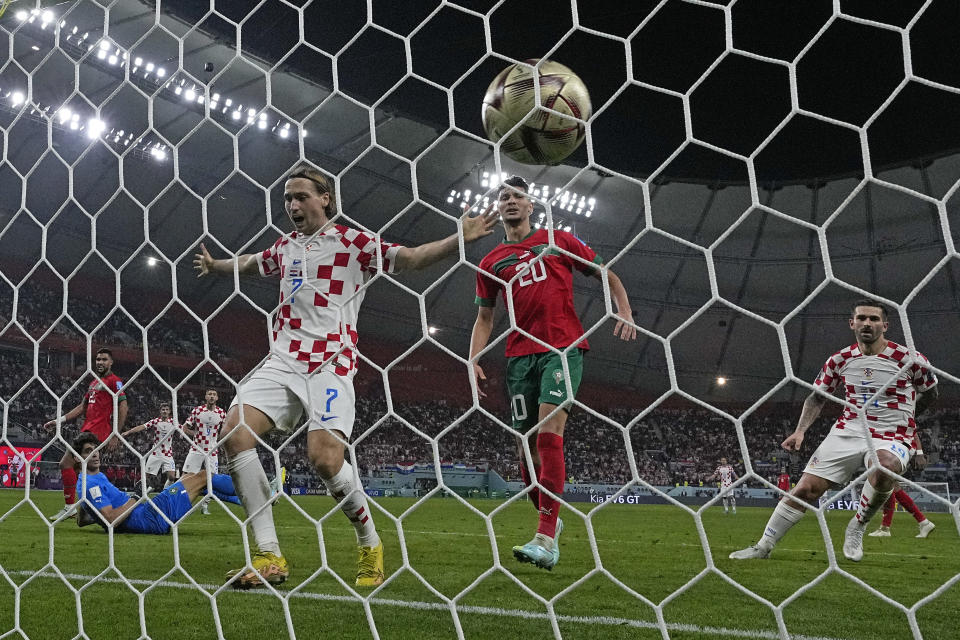 Croatia's Lovro Majer celebrates after Croatia's Mislav Orsic scores his side's second goal during the World Cup third-place playoff soccer match between Croatia and Morocco at Khalifa International Stadium in Doha, Qatar, Saturday, Dec. 17, 2022. (AP Photo/Thanassis Stavrakis)