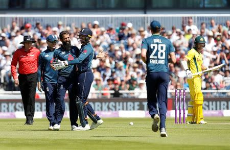 Cricket - England v Australia - Fifth One Day International - Emirates Old Trafford, Manchester, Britain - June 24, 2018 England's Moeen Ali celebrates with teammates after he takes the wicket of Australia's Aaron Finch Action Images via Reuters/Craig Brough