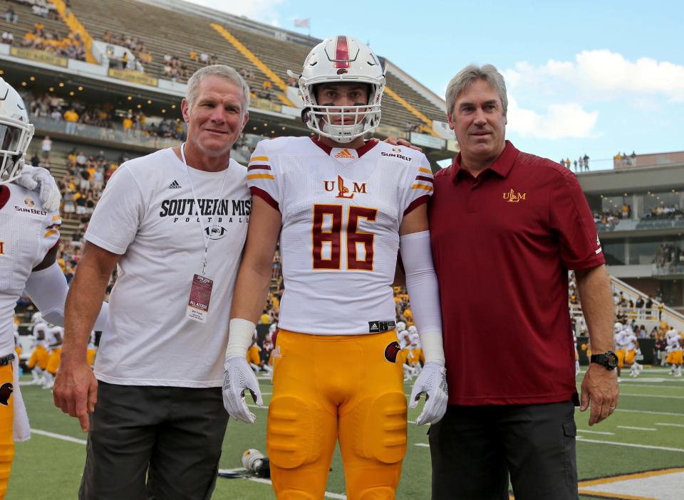 Sep 8, 2018; Hattiesburg, MS, USA; Hall of Fame quarterback Brett Favre with Louisiana Monroe Warhawks tight end Josh Pederson (86) and his father, Philadelphia Eagles head coach Doug Pederson, before the game between the Southern Miss Golden Eagles and the Louisiana Monroe Warhawks at M. M. Roberts Stadium. Favre played for Southern Miss and Pederson played at Louisiana Monroe. Mandatory Credit: Chuck Cook-USA TODAY Sports