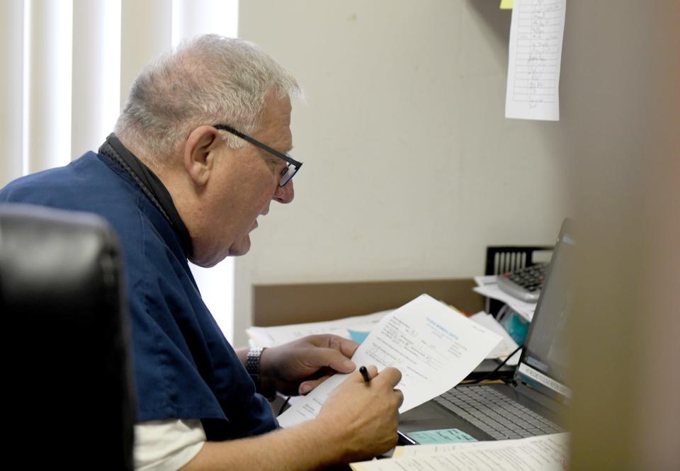 Dr. David Burkons conducts a Zoom call with a patient Friday at Northeast Ohio Women's Center in Cuyahoga Falls.