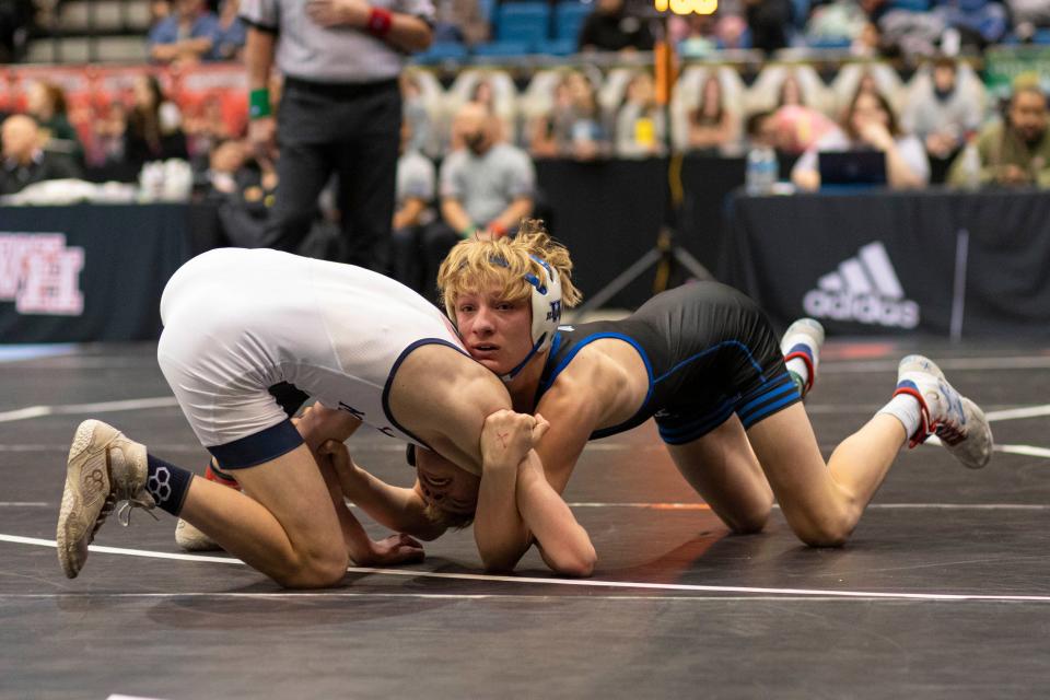 Washburn Rural's Ryder Harrison wrestles against Mill Valley's Jeredy Nilges in the 6A Boys State Wrestling tournament on Saturday, Feb. 24, 2024.