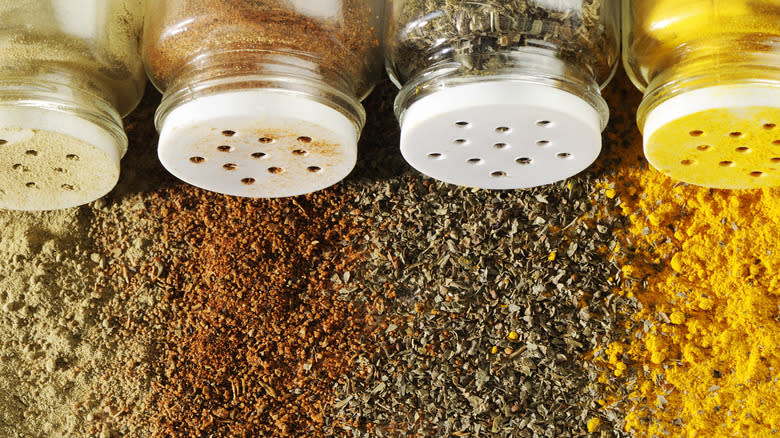 bottles of spilled spices and seasonings