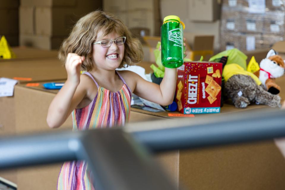 Brevard 9-year-old Annie, who suffers from congenital heart disease, shows her excitement after receiving gifts from Make-A-Wish Central & Western North Carolina and SylvanSport.