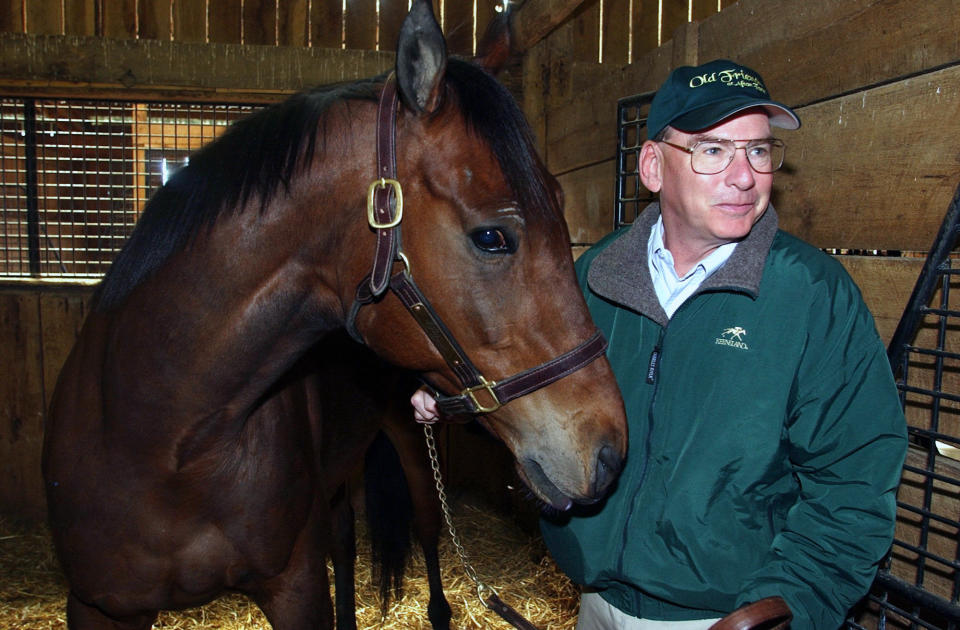 FILE - Michael Blowen prepares to take Rich in Dallas out of his stall on Afton farm near Midway, Ky., April 6, 2004. Blowen's love for horses stretched far beyond the racetrack and spurred him into starting a mid-life career as founder of a retirement farm in Kentucky, where older thoroughbreds could spend their remaining years in dignity and security — long after their earning days were over. (AP Photo/James Crisp, File)