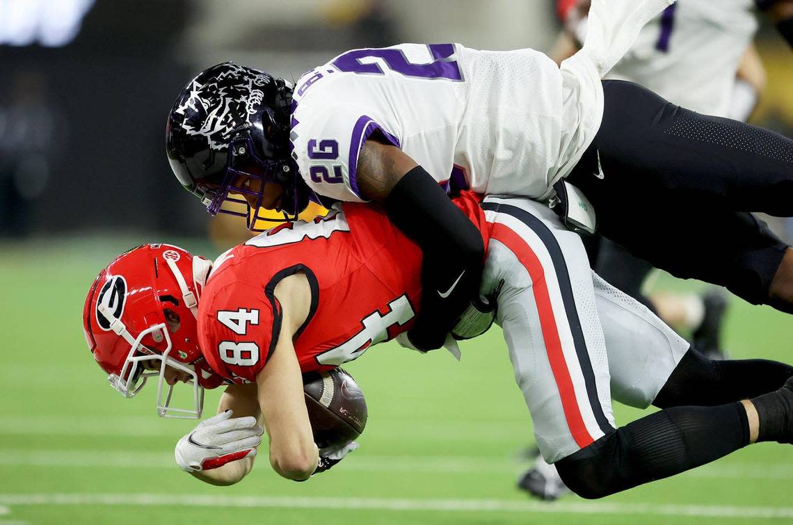 TCU safety Bud Clark tackles Georgia wide receiver Ladd McConkey during the 2023 College Football Playoff National Championship on Jan. 9, 2023, at SoFi Stadium.