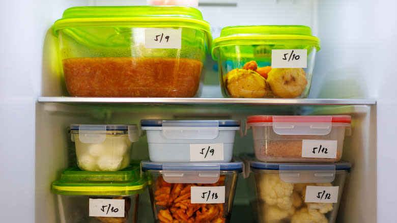Containers of food labeled in fridge 