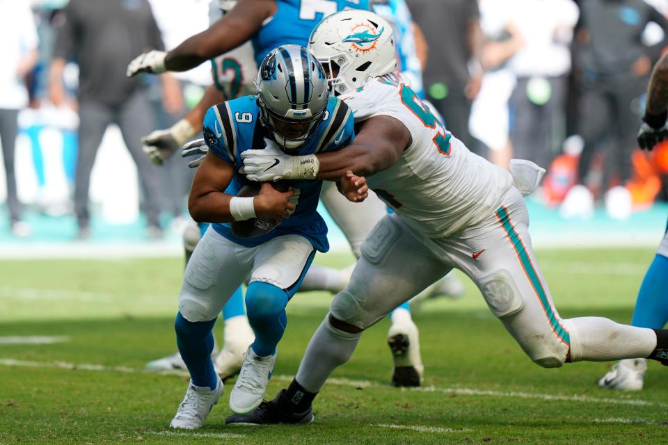 Miami Dolphins defensive tackle Christian Wilkins (94) sacks Carolina Panthers quarterback Bryce Young (9) during the second half of an NFL football game, Sunday, Oct. 15, 2023, in Miami Gardens, Fla. (AP Photo/Wilfredo Lee)