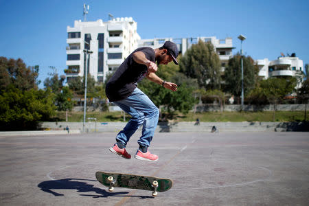 Palestinian Mohammad Al-Sawalhe, 23, a member of Gaza Skating Team, practices his skating skills in Gaza City March 10, 2019. REUTERS/Mohammed Salem