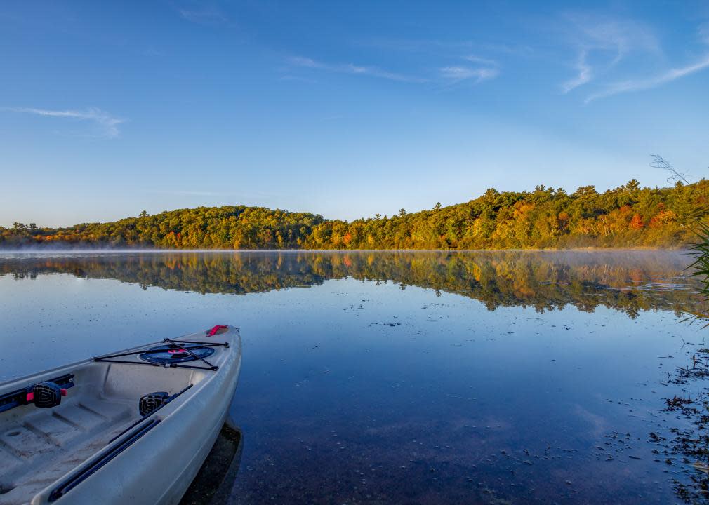 Morning sunrise of a kayak on a calm McKenzie Lake.