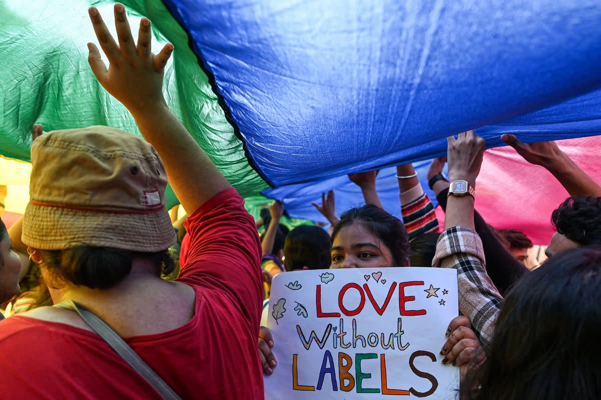 Gender rights activists and supporters of the LGBT+ community attend a pride parade in Mumbai on 24 June 2023 (AFP via Getty)