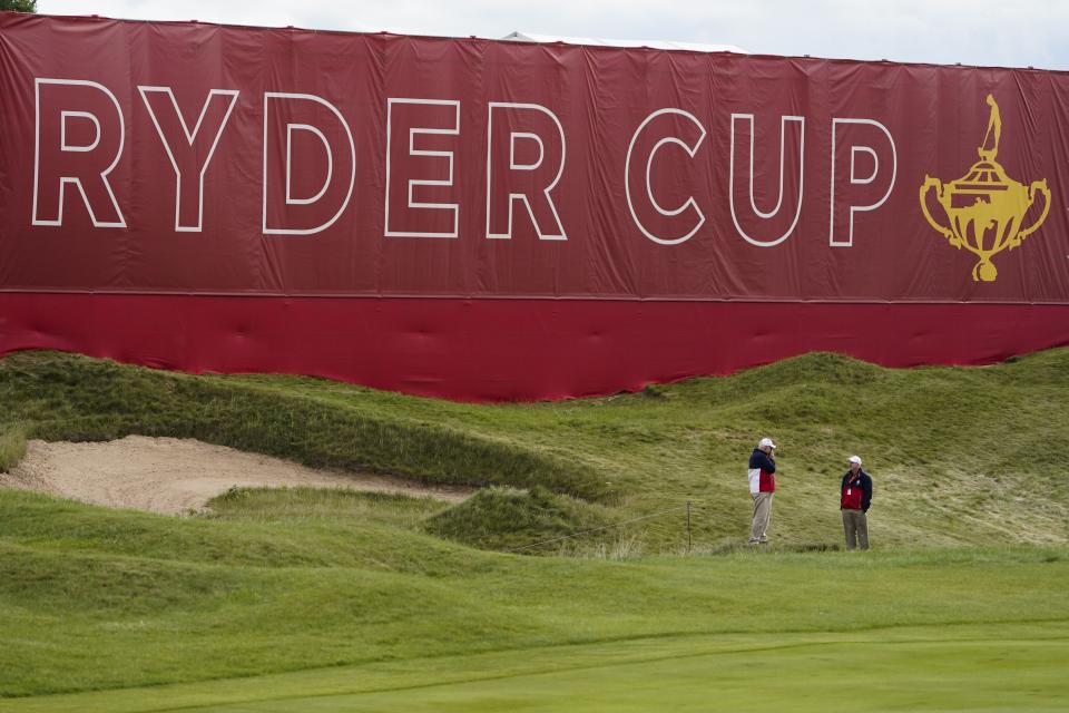 Marshalls stand near the green on the first hole during a practice day at the Ryder Cup at the Whistling Straits Golf Course Wednesday, Sept. 22, 2021, in Sheboygan, Wis. (AP Photo/Jeff Roberson)