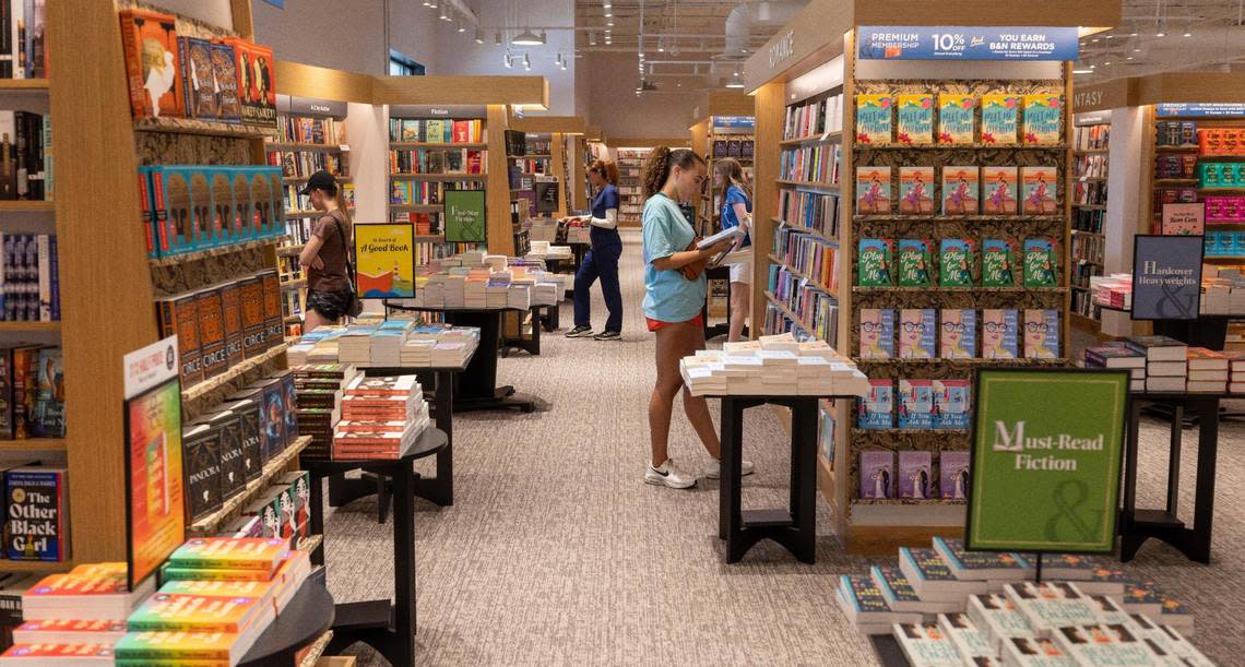 Book lovers browse the titles at the new Barnes & Noble which opened in the Shoppes of Kildare at 1311 Kildaire Farm Road on Wednesday, July 5, 2023 in Cary, N.C. The new redesigned 27,000 square foot space is just two miles from the former location in Cary Commons.