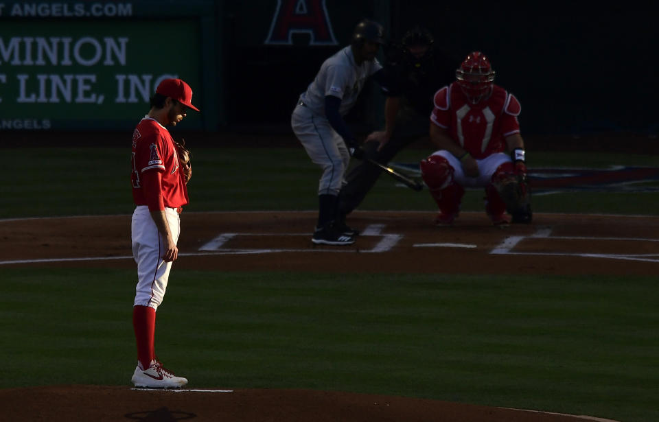 Los Angeles Angels starting pitcher Noe Ramirez, left, gets set to pitch to Seattle Mariners' Mallex Smith during the first inning of a baseball game Saturday, June 8, 2019, in Anaheim, Calif. (AP Photo/Mark J. Terrill)