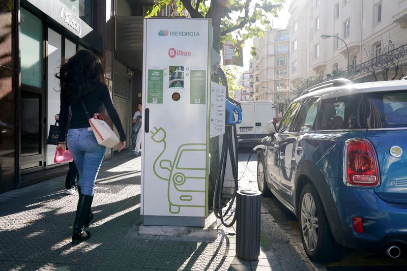 FILE PHOTO: An electric car is charged from an Iberdrola electric car charging station in central Bilbao