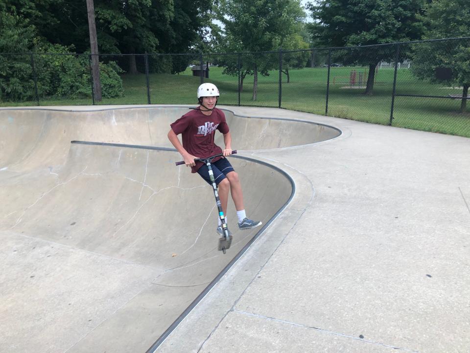 Sean Dauss, 14, skims along the edge of the bowl of the O'Brien Skate Park in South Bend on Sept. 8. 2023.