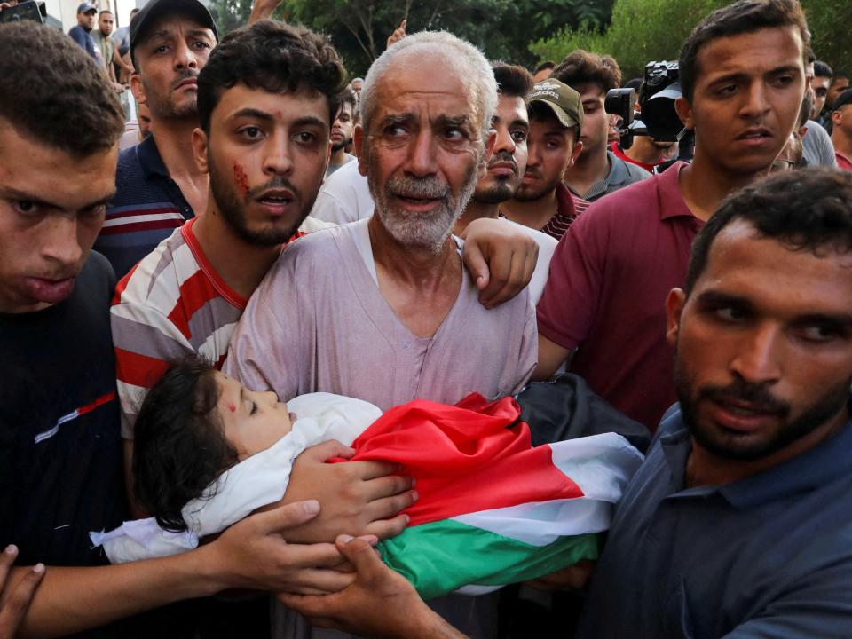 The grandfather of Palestinian girl Alaa Qadoum carries her body in Gaza City August 5, 2022.