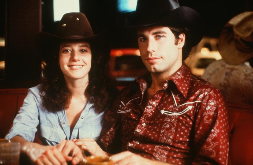 Debra Winger and John Travolta in the movie <em>Urban Cowboy</em> in 1980. (Photo: Hulton Archive/Getty Images)