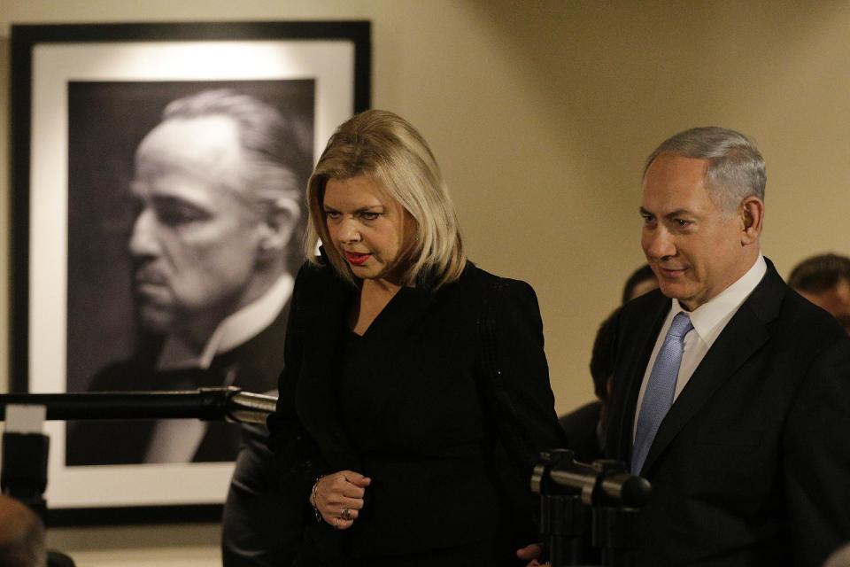 Israeli Prime Minister Benjamin Netanyahu, right, and his wife Sara, arrive for the screening of the television documentary "Israel: The Royal Tour" at Paramount Studios on Tuesday, March 4, 2014, in Los Angeles. Netanyahu flew Tuesday from Washington, D.C., to California, trading a focus on the geopolitics of the Middle East for a Hollywood screening and visits with Silicon Valley tech entrepreneurs. (AP Photo/Jae C. Hong)