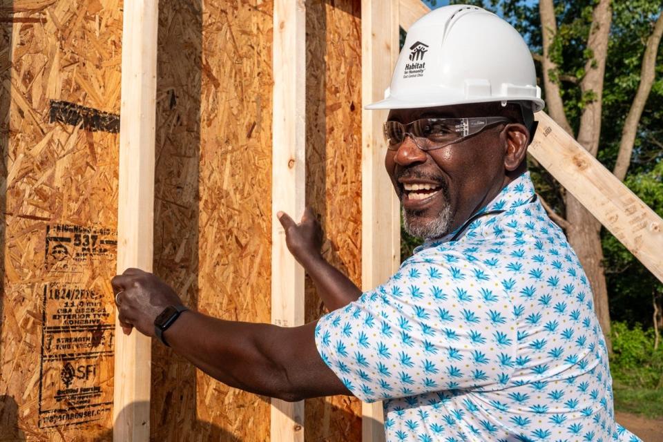 Pro Football Hall of Famers and alumni helped raise walls at the Vargas-Rivera family's new home at at 1469 Housel Ave. SE.