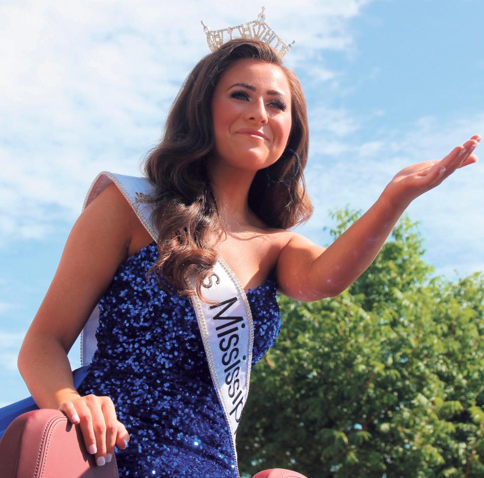 Miss Mississippi Holly Brand waves during a parade in her honor in Meridian, Miss on Saturday, Aug. 14, 2021. Brand, a native of Meridian, will represent Mississippi in the Miss America competition in December.